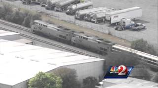 Raw video: Chopper 2 over train vs. car collision