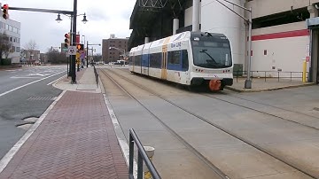 A NEW JERSEY TRANSIT RIVER LINE TRAIN PASSING THE WALTER RAND TRANSPORTATION CENTER IN CAMDEN