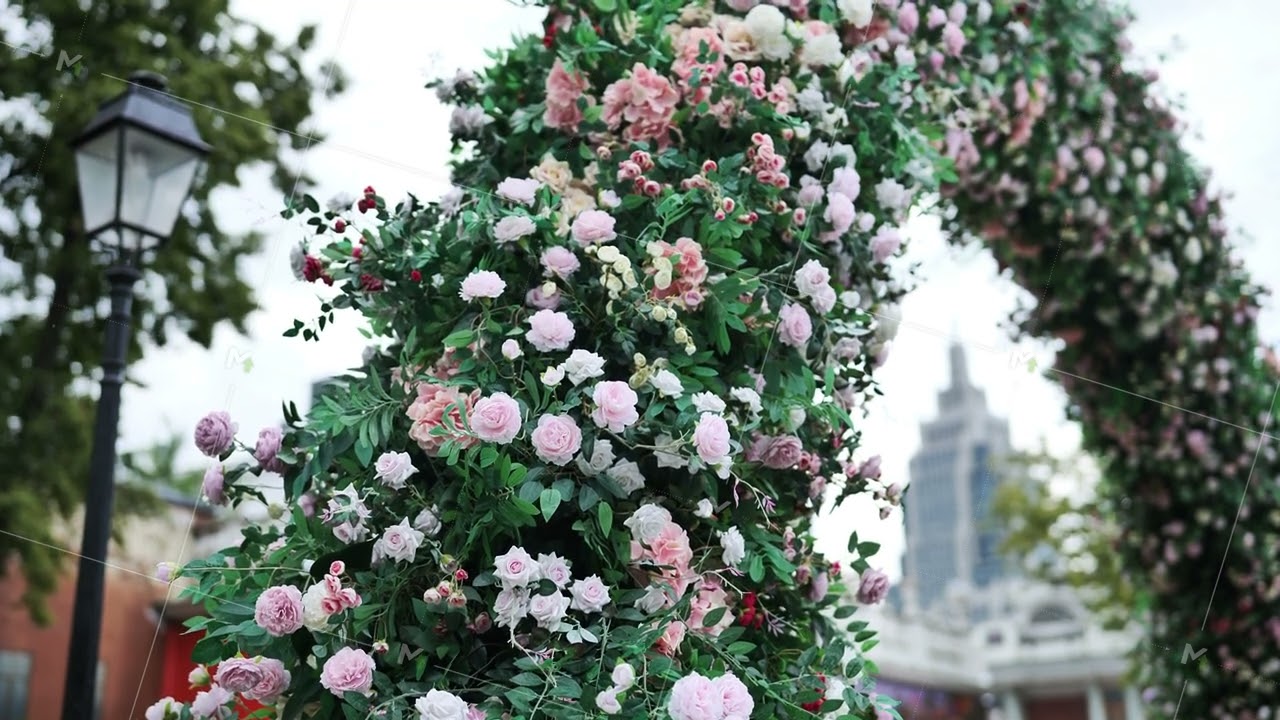 Floral arch decorating a city park with Empire State Building in background