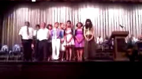 Elaina singing her solo at Farrell, PA school