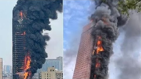 Massive fire engulfs skyscraper in China