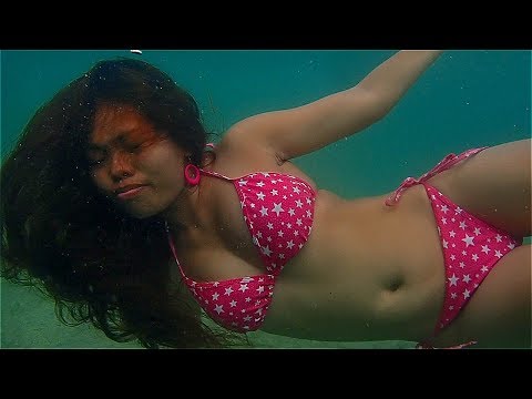 Asian bikini model underwater