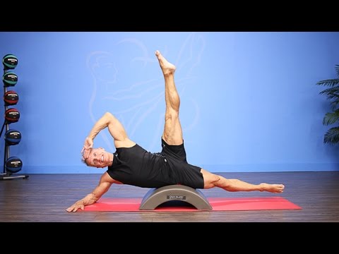 Developé Side Plank on Pilates Arc Barrel