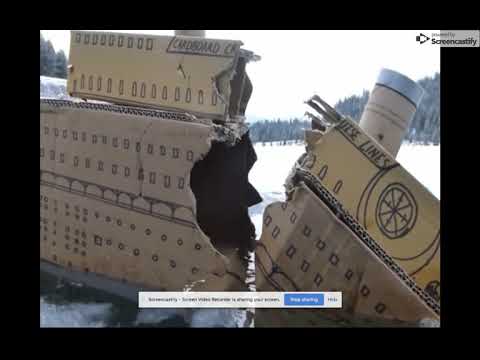 Titanic mad out of cardboard boxes sinked and broke and a bit of a battleship