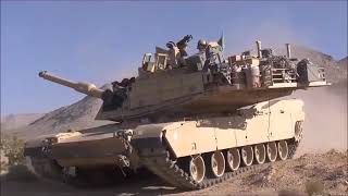 US Army Abrams M1A2 and M2A3 Bradley during live fire exercises