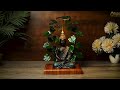 Resin buddha idol sitting under metal tree with led  statuestudio