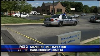 One armed robbery suspect killed, another on the loose in Clinton Twp.