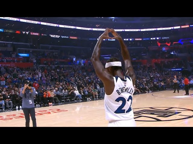 Patrick Beverley jumps on the scorers table and throws his jersey