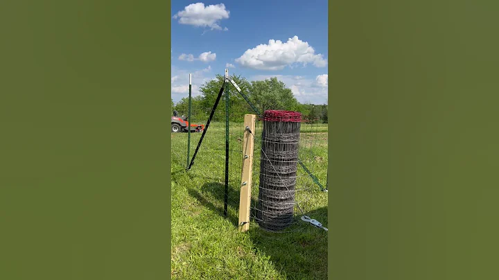 Stretching livestock fencing around our vegetable garden. Homemade diy fence stretcher.