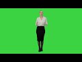 young pretty woman presents something on a green screen chroma key