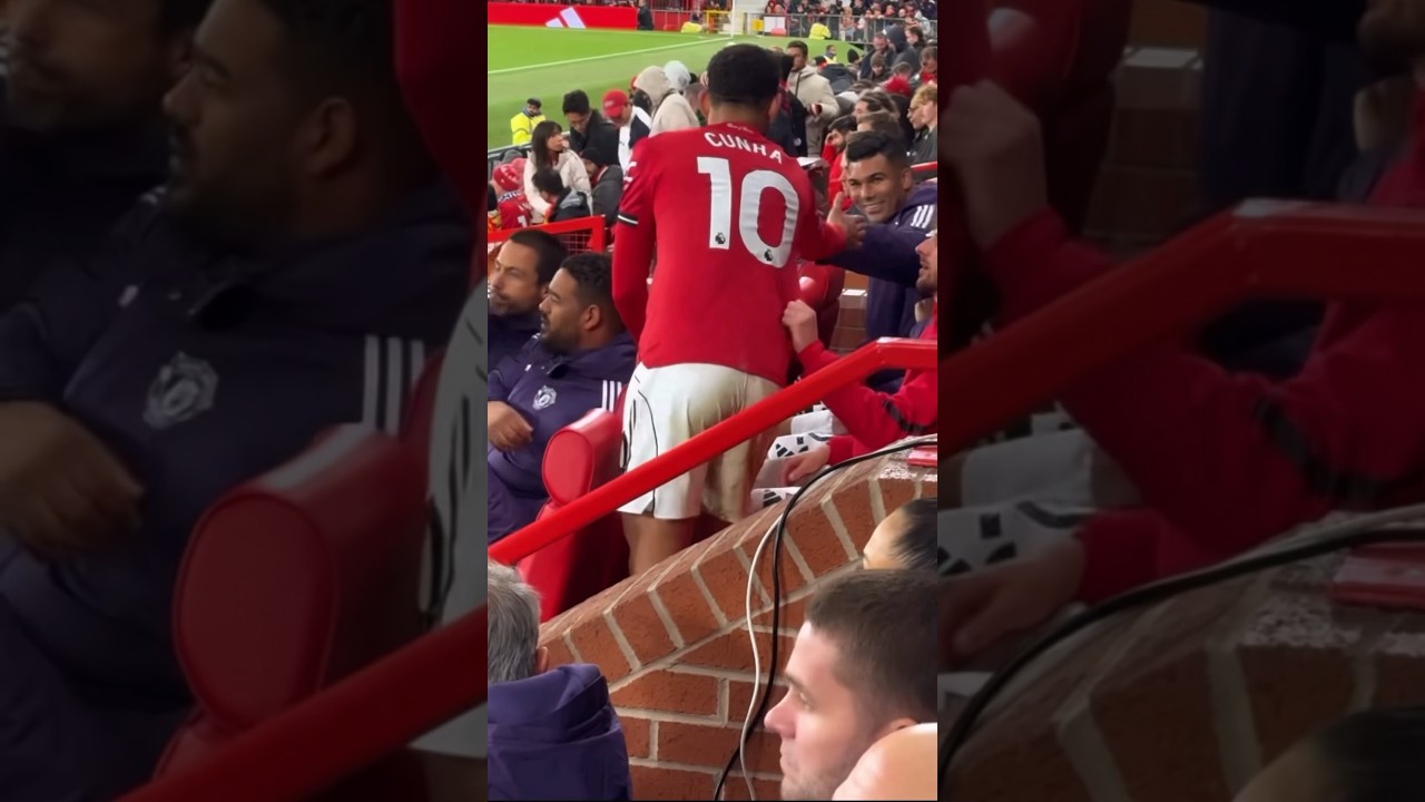 Casemiro and Cunha high five on the bench after his man of the match performance