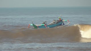 Big Waves for Small Wooden Boat