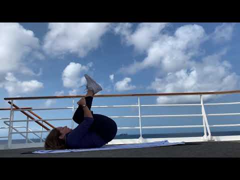 Pilates Rolling Like A Ball under Aruba Sky