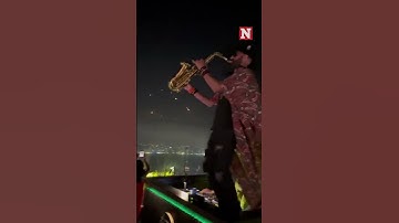 Saxophonist Seen Playing As Iranian Missiles Target Israel In The Background