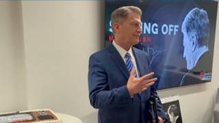 Mike Bush speaks at retirement luncheon