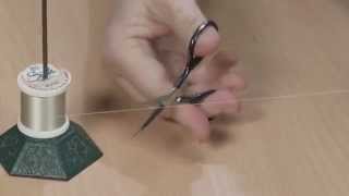 Use a Bill-spike to Stabilize a Thread Spool
