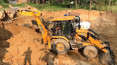 JCB Backhoe Cutting Soil - JCB Backhoe Loader Loading Soil In Tripper Dump
