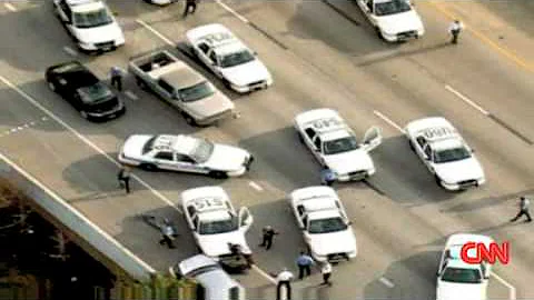 CNN: driver flips over police car