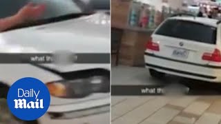Shocking moment driver cruises through crowded shopping mall