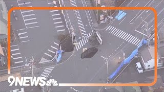 Sinkhole swallows large truck in Yashio City, Japan
