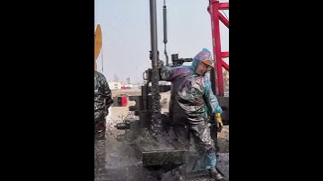 The process of drilling a pole into the ground