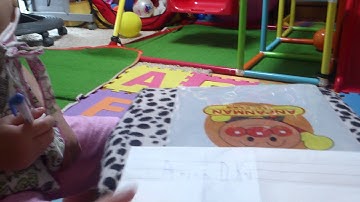 Arisa writing her name in romanji letters