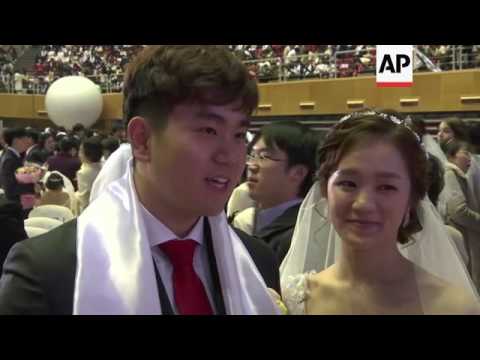 Thousands marry in mass wedding at Unification Church