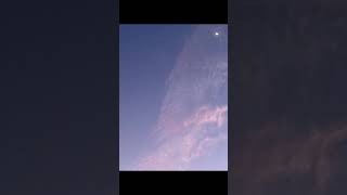 Den Skies And Pink Clouds Helicopter Adventure Over Sparkling Water.