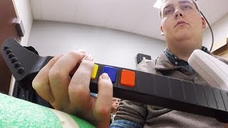 Scientists Help A Paralyzed Man Play Guitar Hero - Newsy