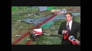 Weatherman Mark Johnson uses weed wacker on live TV