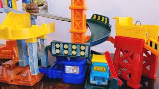Cars, Trucks, and Marbles Race Down the Toy Construction Spiral Tower