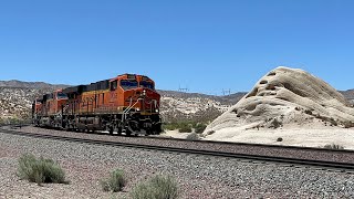 Long Snake BNSF Manifest Train Coming Through The Rocks! Milepost 60.22. Blue Skies! 4KHDR!