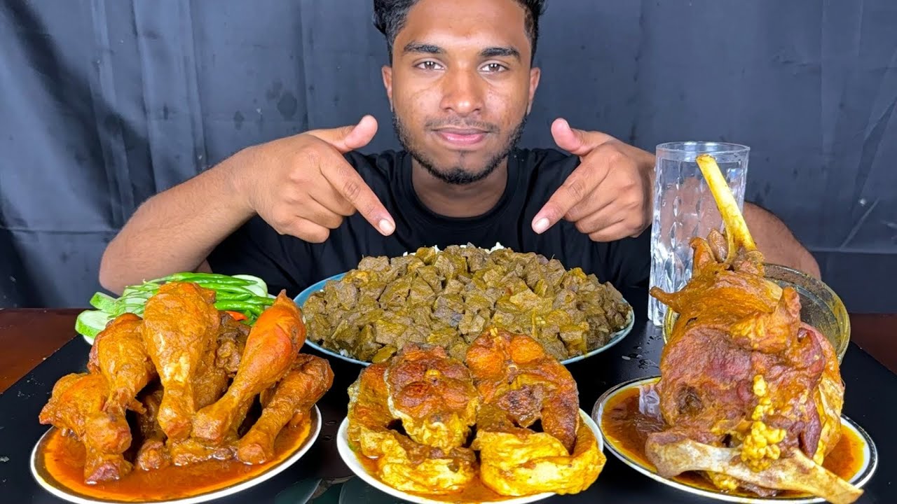 spicy mutton liver curry, full mutton leg piece, fish curry and chicken leg curry with rice eating