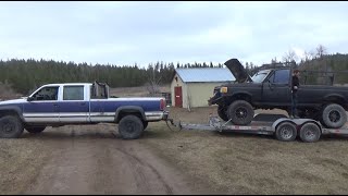 GMC towing a Ford