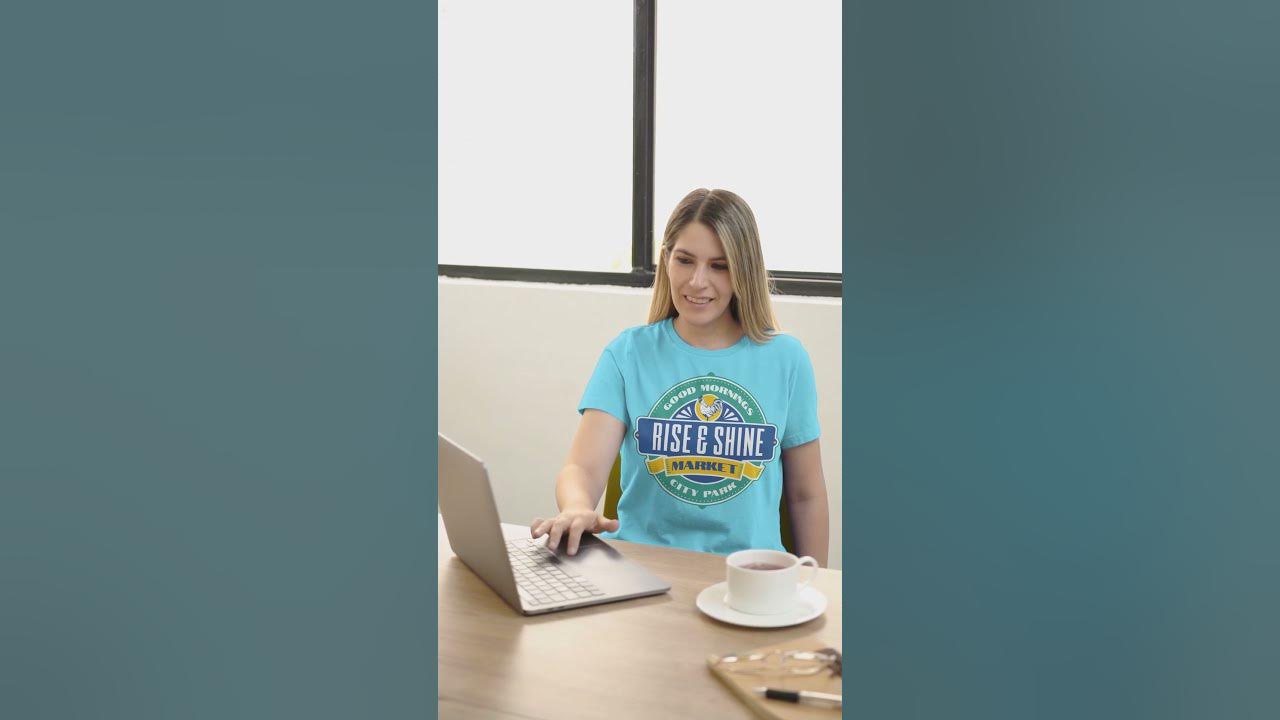 bella-canvas-t-shirt-video-featuring-a-smiling-woman-working-in-an-office-7339v.mp4