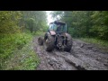Трактор. Трактор в грязи. Трактор мтз тащит уаз.