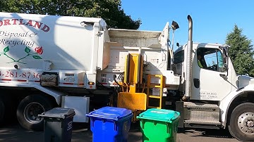 A freightliner  labrie automizer garbage truck on recycling