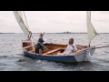 Two luggers at play  wooden boats sailing  rowing