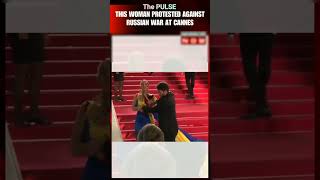 Woman In Flag Colors Pours Fake Blood On Herself Protests Against War