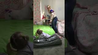 Girl jumps on air mattress and send little girl flying in the air