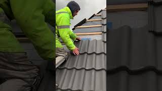 the process of installing roof tiles on a house roof #popular