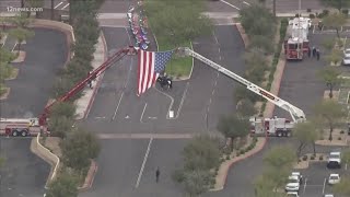 Procession for fallen officer draws thousands of spectators