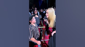 Thumbnail of Adele sings to a young fan in the audience