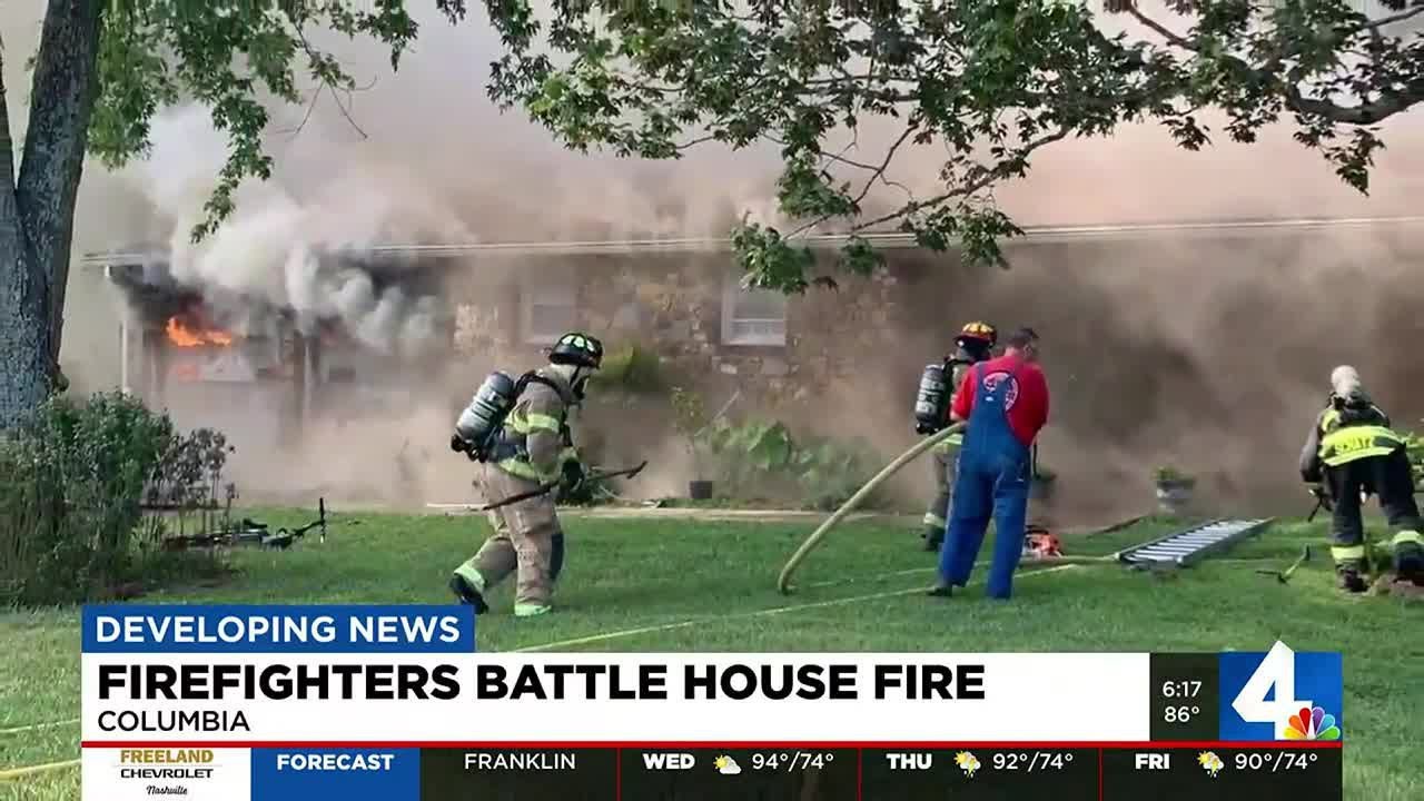 Firefighters battle house fire in Columbia - YouTube