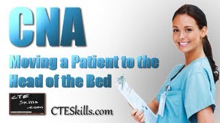 Nurse Assistant Moving A Resident Up In A Bed