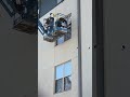 Careful removal of broken windows from outside by a professional