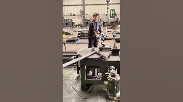 Mechanical Processing: Worker Precisely Bends Metal Pipes