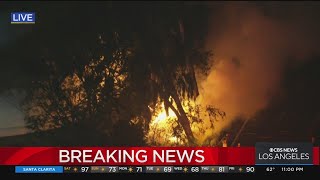 Brush fire breaks out at homeless encampment in South Gate near 710 Freeway