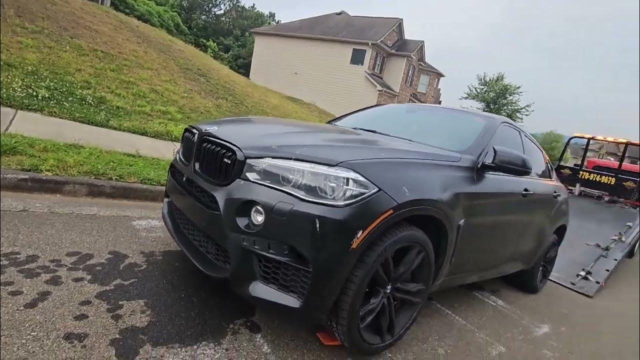 Bmw X6 M series loading on a rollback flatbed towtruck using skates, I ...