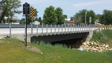 Why is steel an economical solution for short span steel bridges?